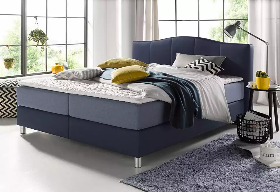 Lit bleu marine avec sur-matelas