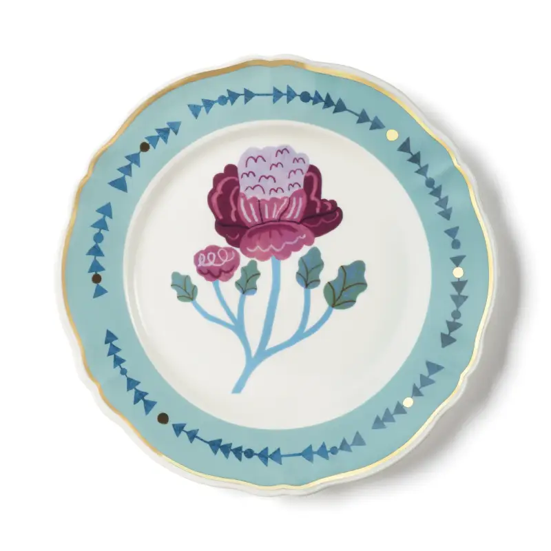 Assiette plate, motif fleur au centre