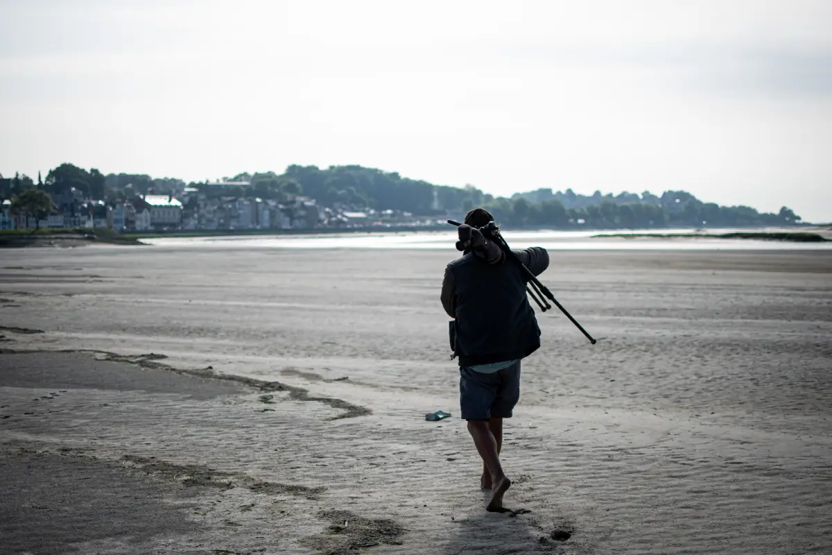 Photographe sur la plage